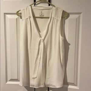 Cream colored sleeveless blouse